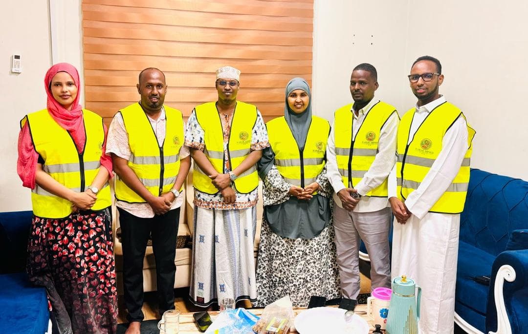 WAF team members in branded vests during a field visit